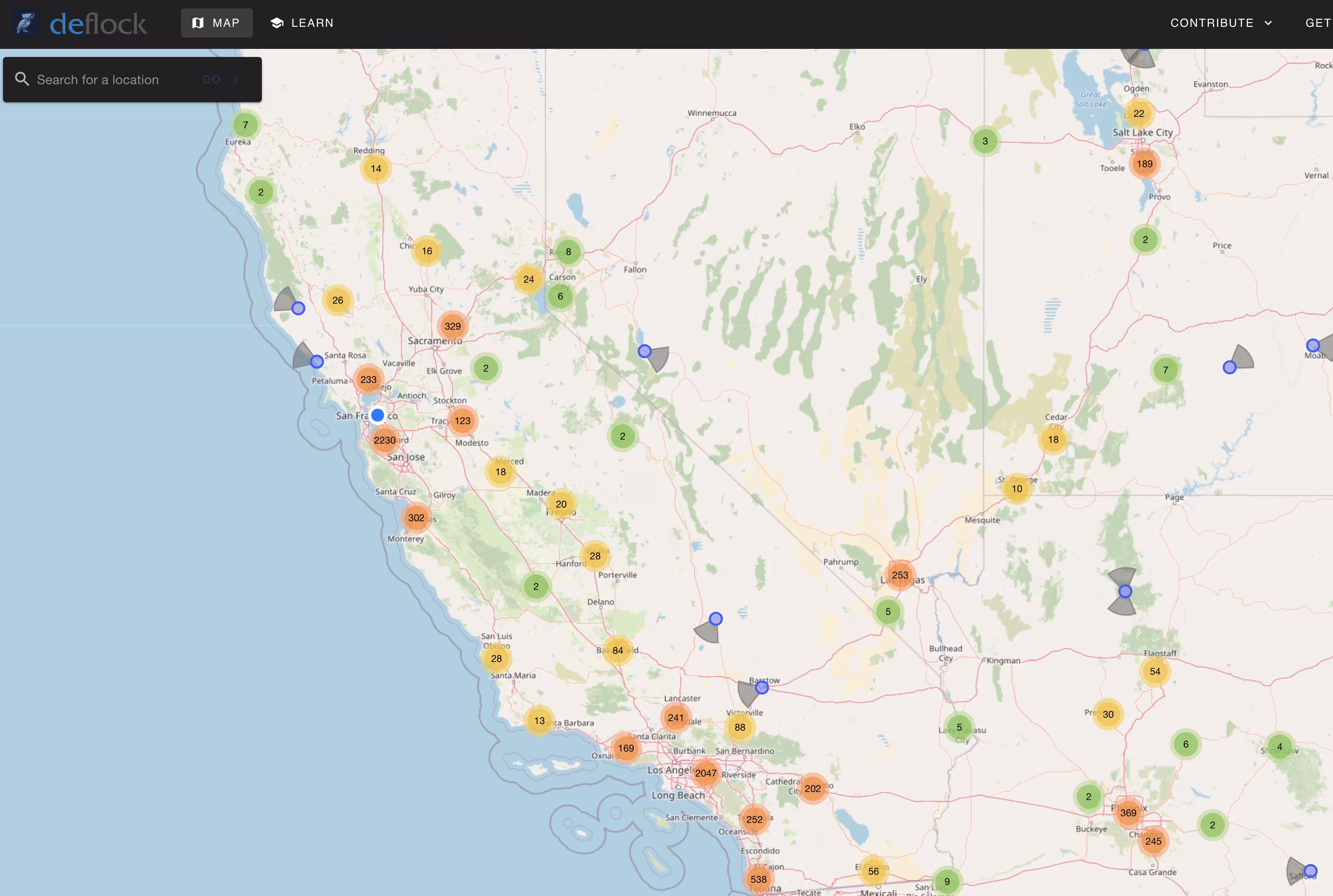 A map from deflock.me showing the locations of known Automated License Plate Readers in California and Nevada. Colored circles indicate numerous camera clusters, with high concentrations in major cities like Los Angeles and the San Francisco Bay Area, and along highways.